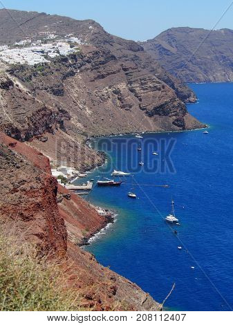 A view of the coastline of Santorini with red sand beach Greece.
