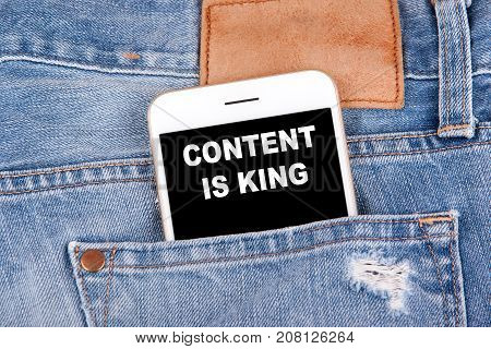 Content is king. Smartphone in front pocket. Technology business analysis and strategy background.