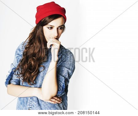 young cheerful brunette teenage girl on white background smiling
