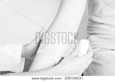 Compression Bandage To Inflammation, Application A Spiral Bandage. Application A Spiral Bandage In S
