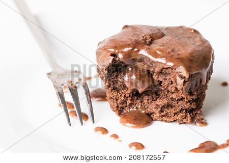 Sliced Chocolate Cup Cake Muffing With Topping Melting Chocolate Cream Above White Marble Background