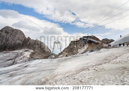 People Hiking Around Dachstein Hunerkogel Mountain Station, Alps, Austria