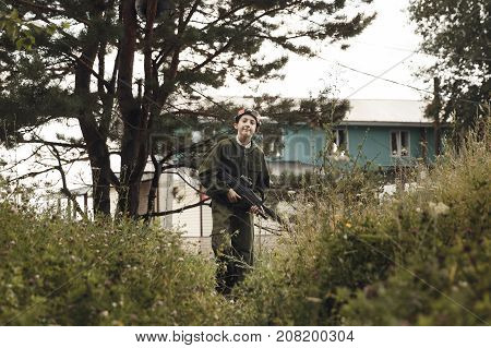 Young Boy In Camouflage With A Gun, Lasertag