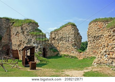 View of beautiful ruins of Bauska castle in Latvia under the blue sky in summer day