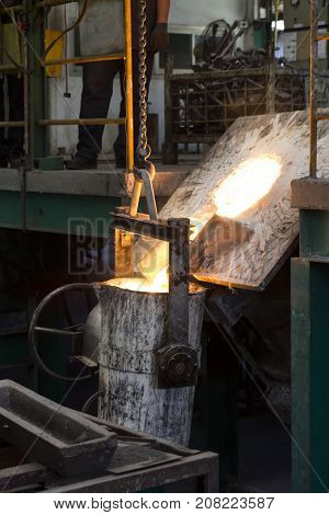 Molten iron molten metal poured in to ladle ; foundry factory