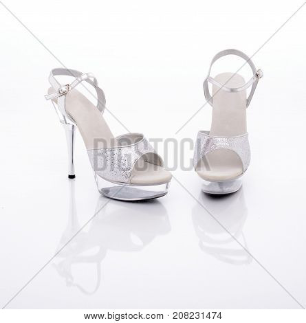 silver High heels stripper shoes on a white background