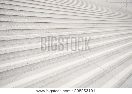 Stairs on grey cement background in Paris France. Symmetry and geometry. Dream perspective progress and future success concept