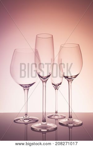 Glassware Selection With Wine, Champagne And Liquour Glasses  On Creative Background
