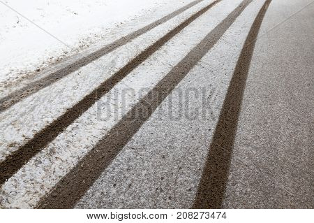 A Snow-covered Road In The Winter Season. Close-up Photo