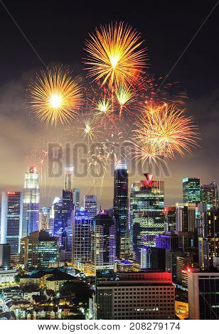 Firework Over Cityscape Of Singapore City At Night