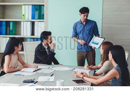 Man making a business presentation to group.