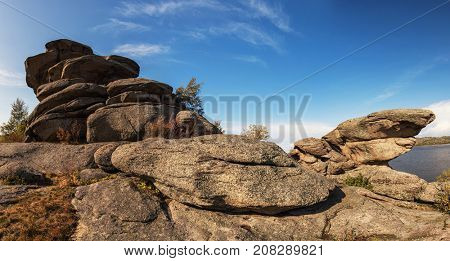 Bizarre forms of weathering of coastal rocks at the Kolyvan lake - a lake at the foot of the northern slope of the Kolyvan Ridge in the Altai Territory of Russia.