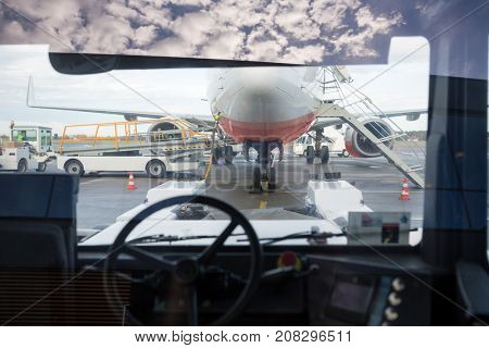 Airplane Seen Through Towing Truck