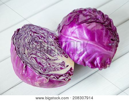 close up of a red cabbage on a wooden table