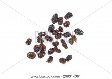 black raisins isolated on white and wooden background