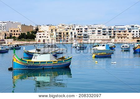 BIRZEBBUGA, MALTA - APRIL 1, 2017 - Traditional Maltese fishing boats in the harbour Birzebbuga Malta Europe, April 1, 2017.