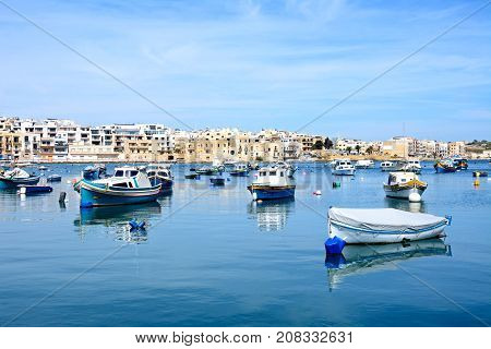 BIRZEBBUGA, MALTA - APRIL 1, 2017 - Traditional Maltese fishing boats in the harbour Birzebbuga Malta Europe, April 1, 2017.