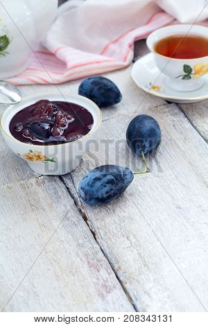 Plum Jam In A Bowl On A Wooden Table