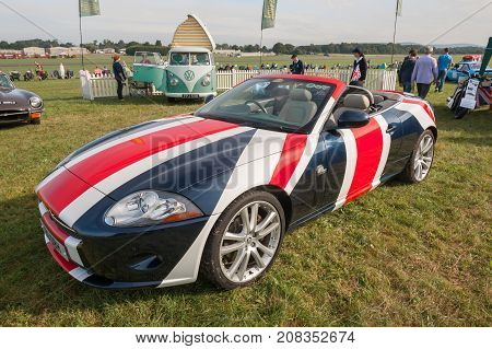 DUNSFOLD, UK - AUGUST 26: Special edition Jaguar XK drop-top convertible with GB flag paintwork at a gathering of vintage vehicles in Dunsfold, UK on August 26, 2017