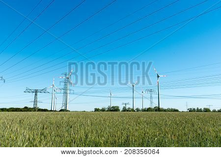 Wind power plants and power transmission lines seen in rural Germany