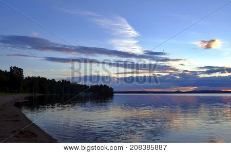 evening colorful cloudy sky over the lake, South Ural, Uvildy