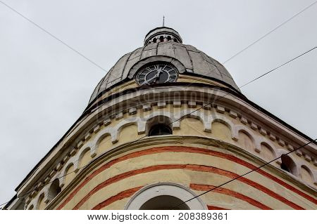 Detail of a beautiful house with a clock from the town of Vratza, Bulgaria