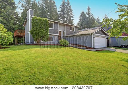 Lovely Grey Rambler House Exterior Features Grey Siding