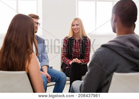 Meeting of support group. Happy woman talking about her life, everything good. Mental health, psychotherapy concept