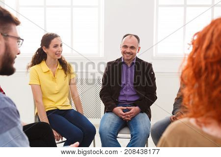 Meeting of support group. Man therapist listening to other people. Mental health, psychotherapy concept