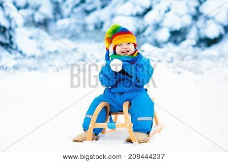 toddler kid riding a sledge children play outdoors in snow kids sled in the alps mountains in winter outdoor fun for family christmas vacation - Christmas Vacation Sled toddler kid riding a sledge children play outdoors in snow kids sled in the alps mountains in winter outdoor fun for family christmas vacation - Christmas Vacation Sled