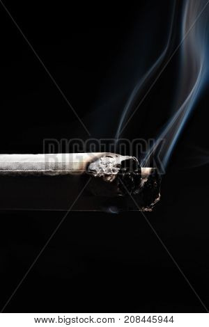 Two Smoking Cigarette On Black Background.copy Space