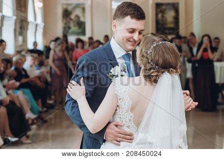 Beautiful Gorgeous Bride And Groom Performing First Dance. Happy Wedding Couple Dancing In Restauran