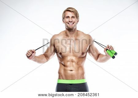 Muscular Bodybuilder Guy Doing Exercises With Jumping Rope