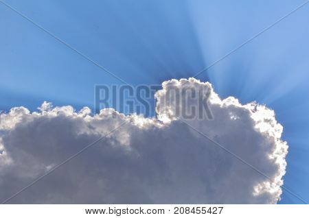 Clouds and rays of sunlight on the blue sky - Szarvas, Hungary