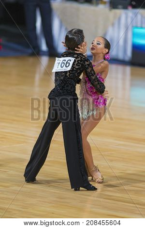 Minsk Belarus-October 7 2017: Dance Couple Of Samadashvili Avtandil and Gogishvili Elene Performs Youth-2 Latin-American Program on WDSF International Capital Cup MinskOctober 72017 MinskBelarus.