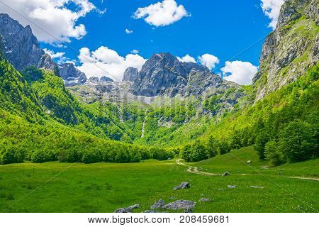Picturesque Meadows And Forests Are Located Among The High Mountains.
