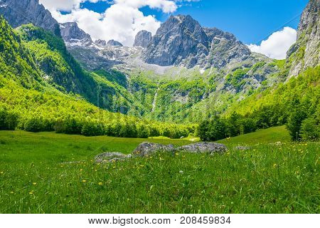 Picturesque Meadows And Forests Are Located Among The High Mountains.