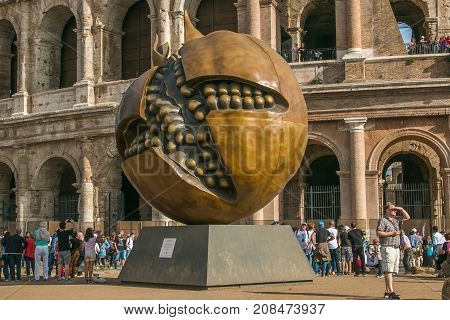 ROME, ITALY - OCTOBER 10, 2017: Pomegranate sculpture of Giuseppe Carta in front of the Colosseum in Rome, Lazio