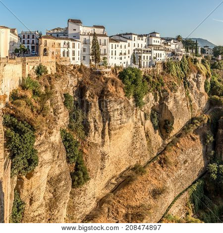 RONDA,SPAIN - SEPTEMBER 29,2017 - View at the old city of Ronda at the bottom of the El Tajo gorge. Ronda is a city in the Spanish province of Malaga.