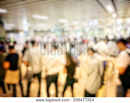 Blurred Image Of Asian People On The Queue Line On Rush Hour Waiting For Train Subway Station. Stay