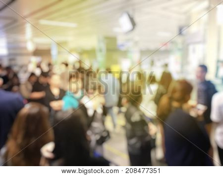 Blurred Image Of Asian People On The Queue Line On Rush Hour Waiting For Train Subway Station. Stay