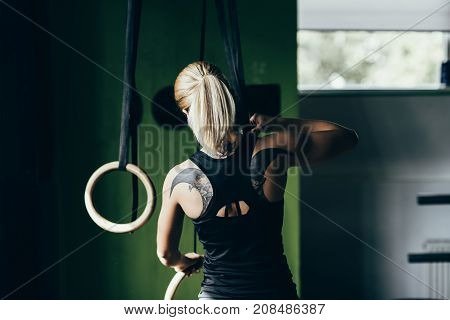 Sportswoman With Gymnastic Rings
