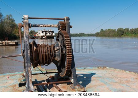 Fluvial Port: Rusted and Old Manual Naval Winch