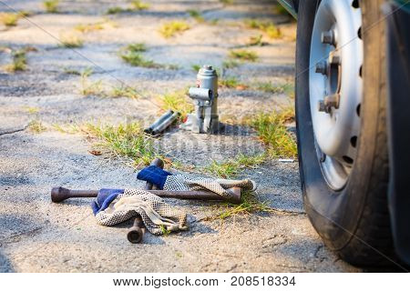 Socket Wheel Wrench And Jack Lying On Ground