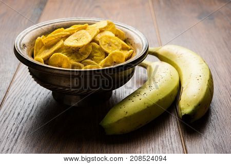 Stock Photo of Healthy Homemade Kela or Banana chips or wafers or Plantain Chips, selective focus