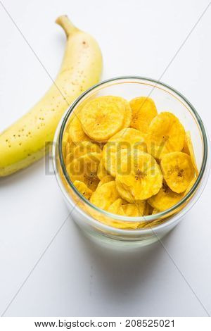 Stock Photo of Healthy Homemade Kela or Banana chips or wafers or Plantain Chips, selective focus