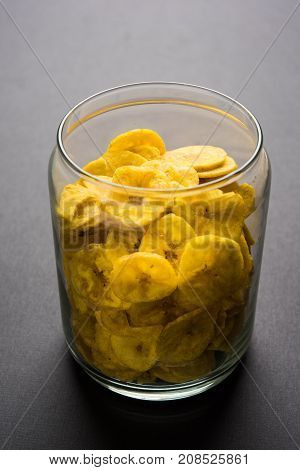 Stock Photo of Healthy Homemade Kela or Banana chips or wafers or Plantain Chips, selective focus