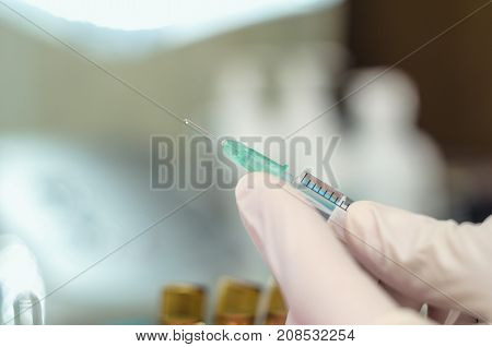 Syringe needle and medicine vial. Injection cosmetology. Anti-aging concept.