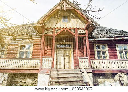 Traditional old house in Zdiar village Slovak republic. Travel destination. Yellow sun rays.