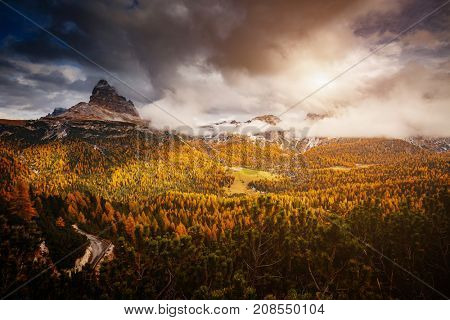 Stunning image of the alpine wallpaper. Dramatic scene, gloomy weather. Location famous place National Park Tre Cime di Lavaredo, Misurina, Dolomiti alps, South Tyrol, Italy, Europe. Beauty world.